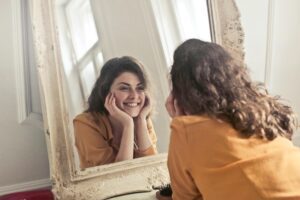 Photo of Woman Looking at the Mirror